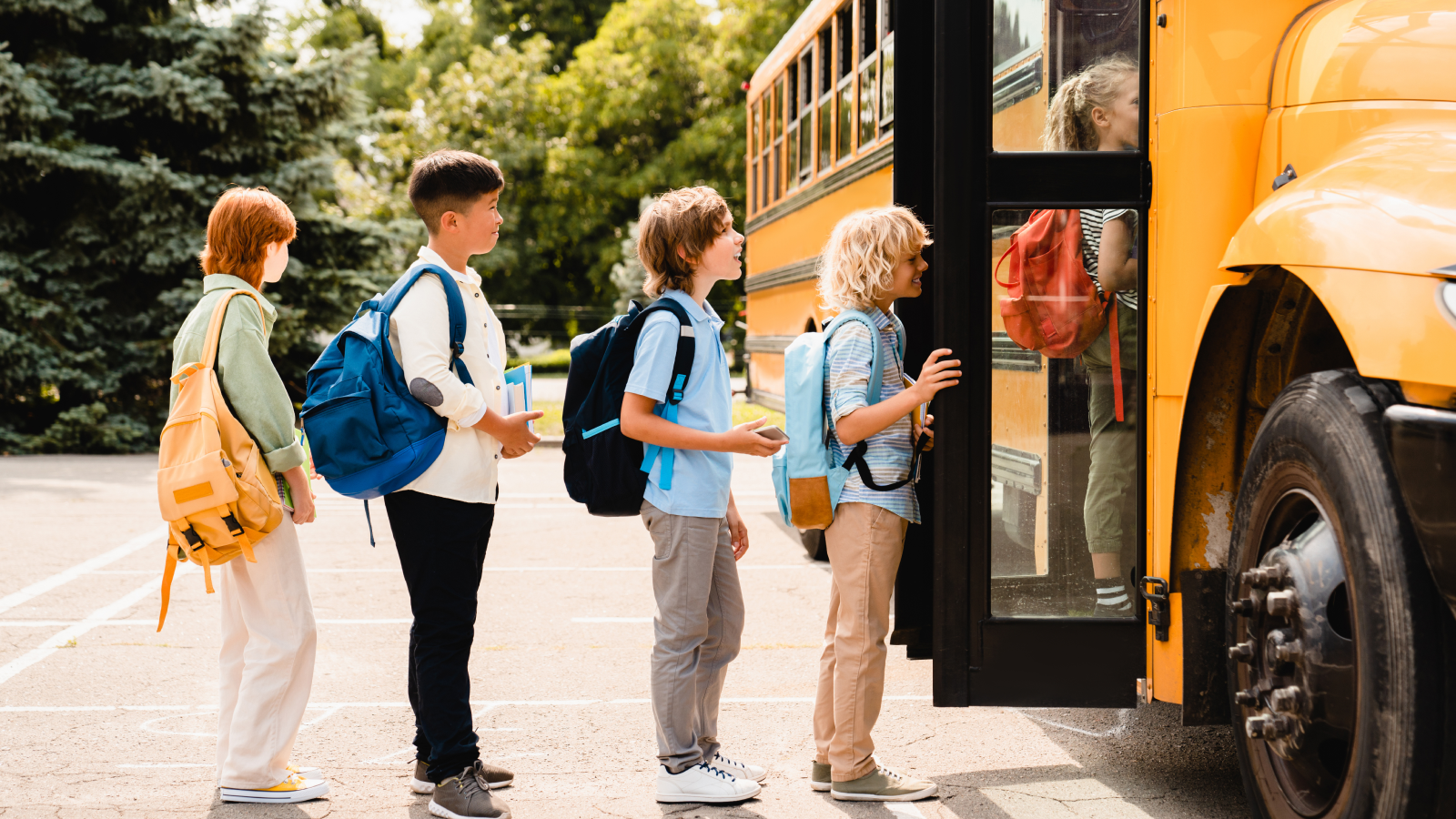 Children lining up to enter school bus.