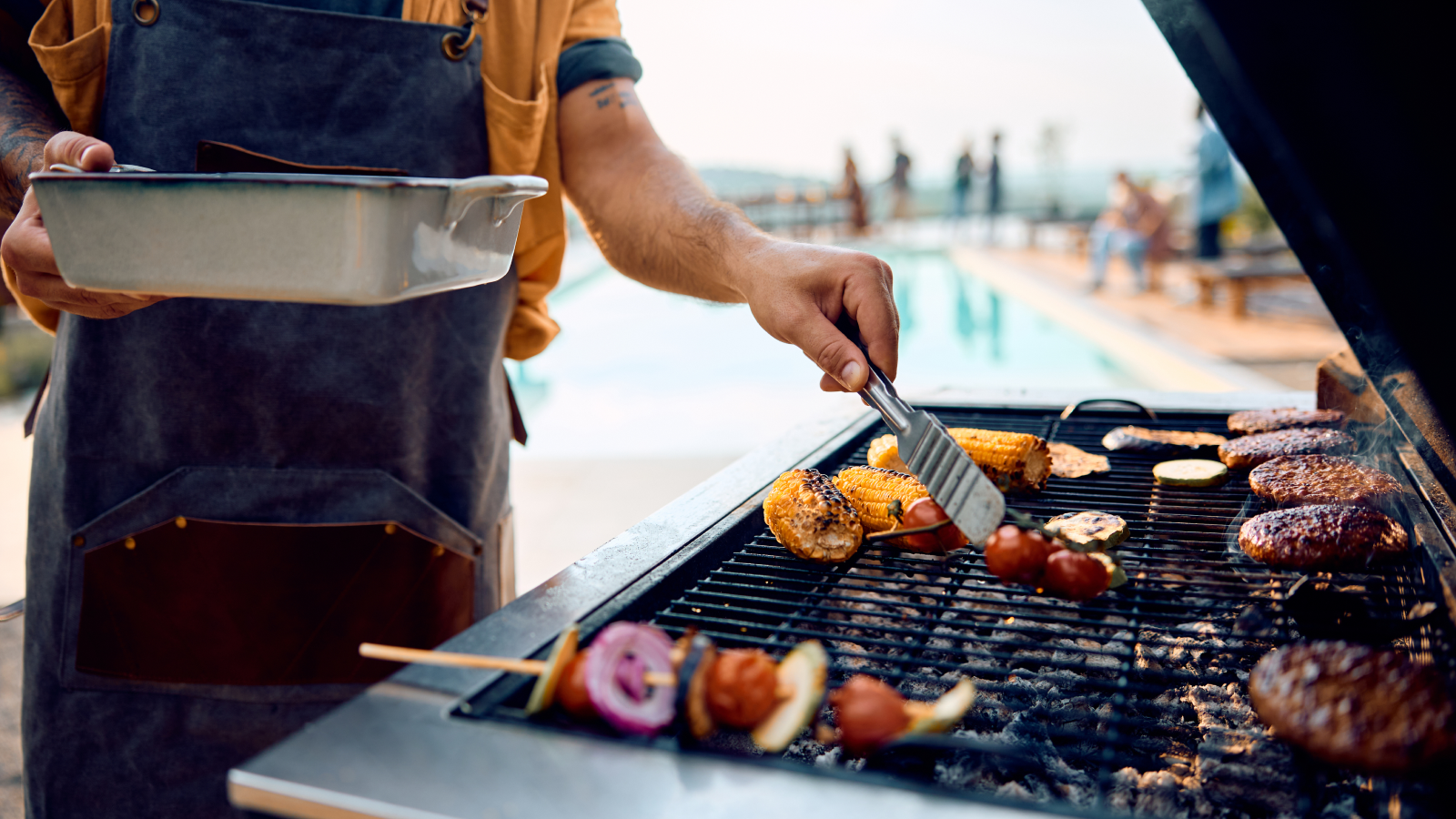 Family barbeque outside in the summertime.