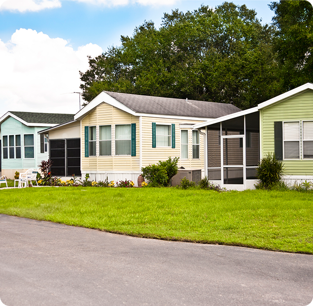 A view from the street of a couple of houses next to each other. 
