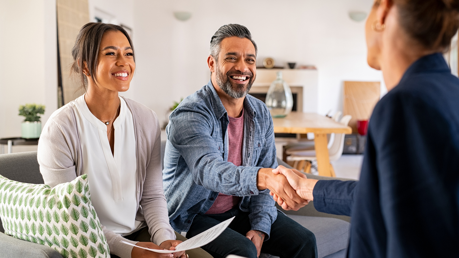 A couple meeting with an agent.