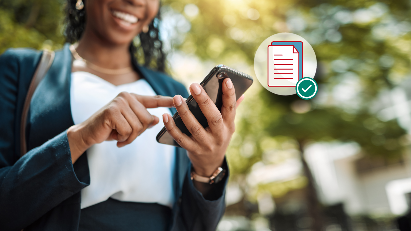 A woman holding her phone and smiling while enrolling in paperless options through Alfa Insurance.