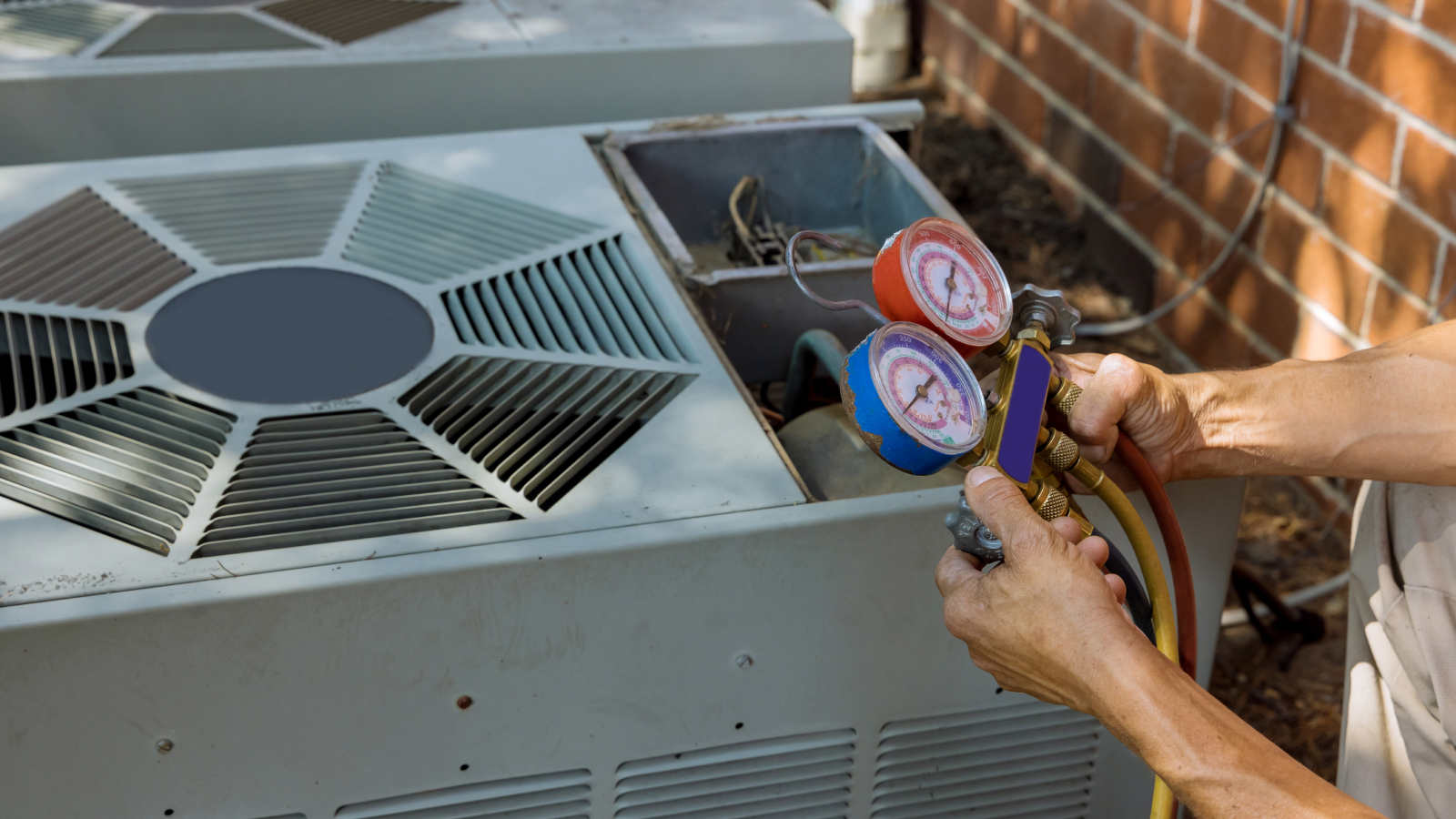person repairing AC unit