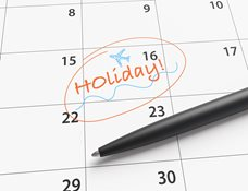 A calendar with a date circled and it says "holiday". 
