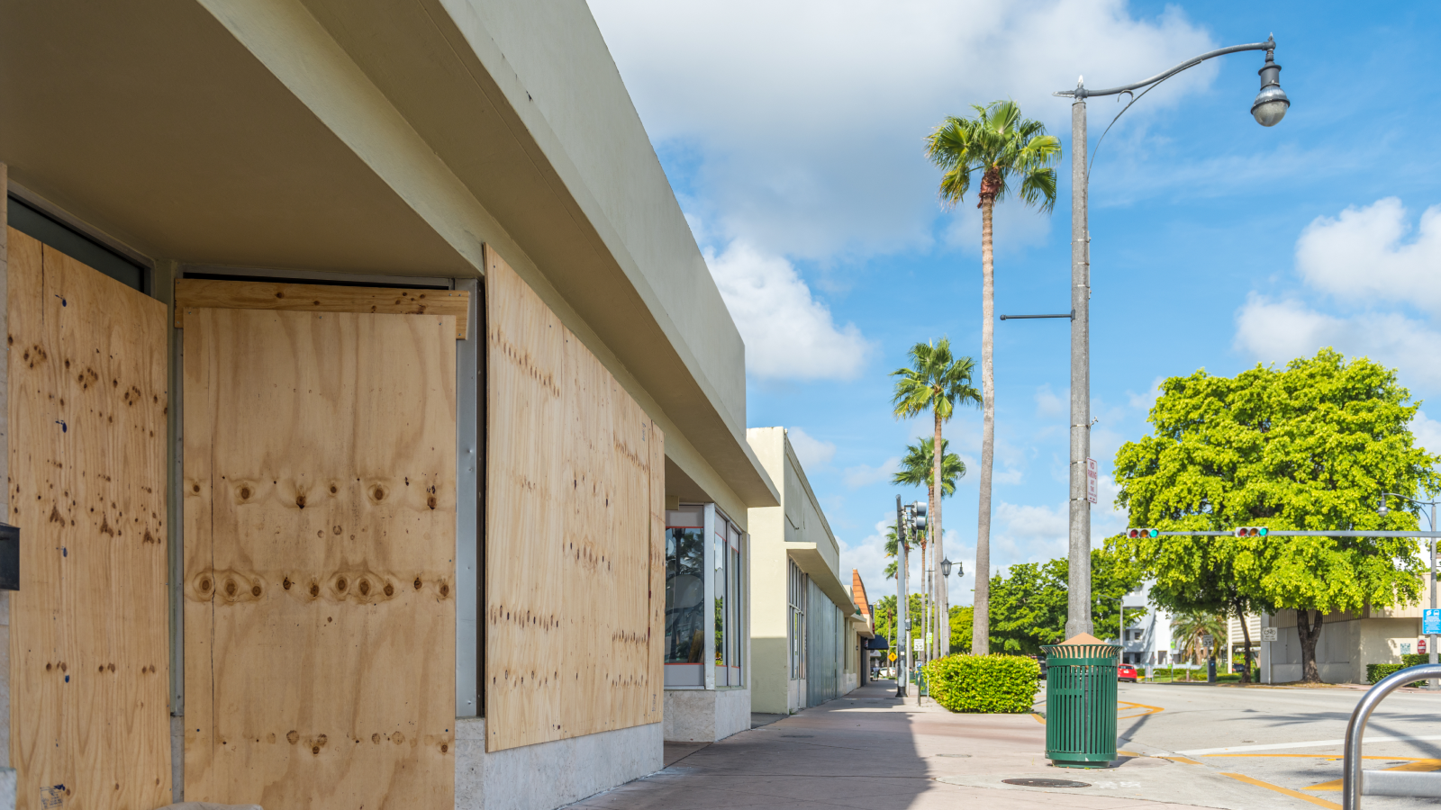 Boarded up windows on downtown storefront. 
