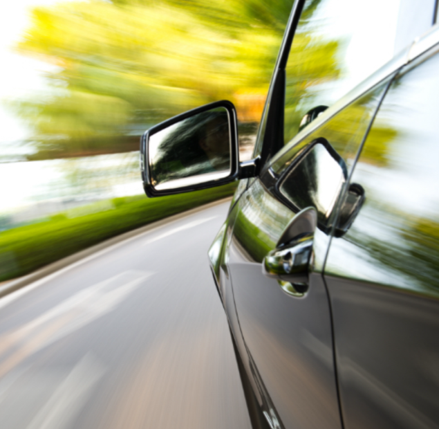 a picture of the side of a car as it is moving