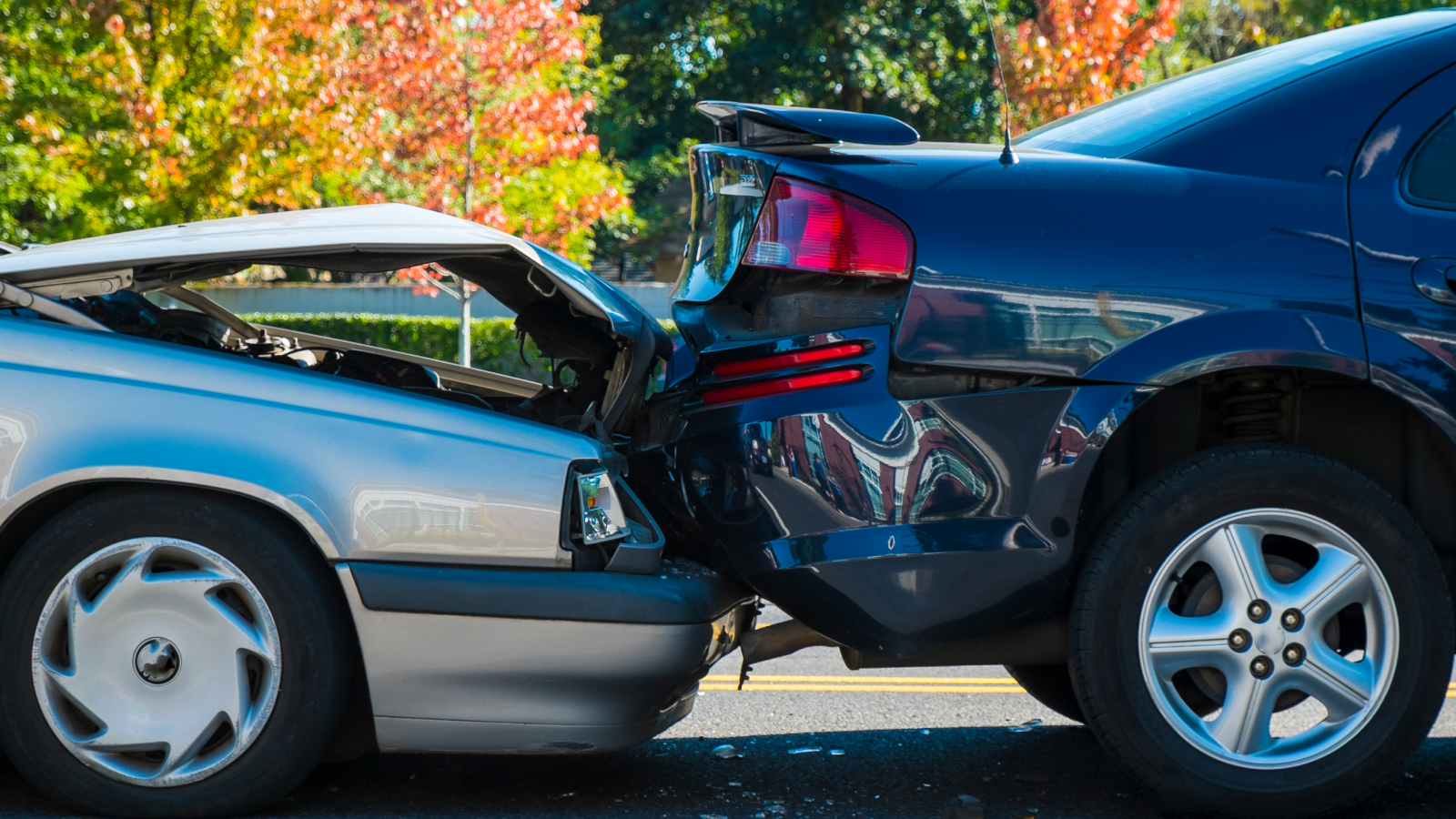 Two vehicles involved in a rear-end collision caused by following too closely.