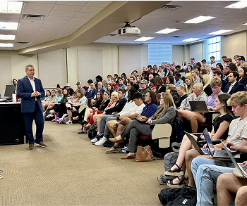 Alfa employee talking to students at Troy University