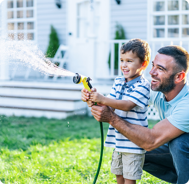Dad and son playing with water house.