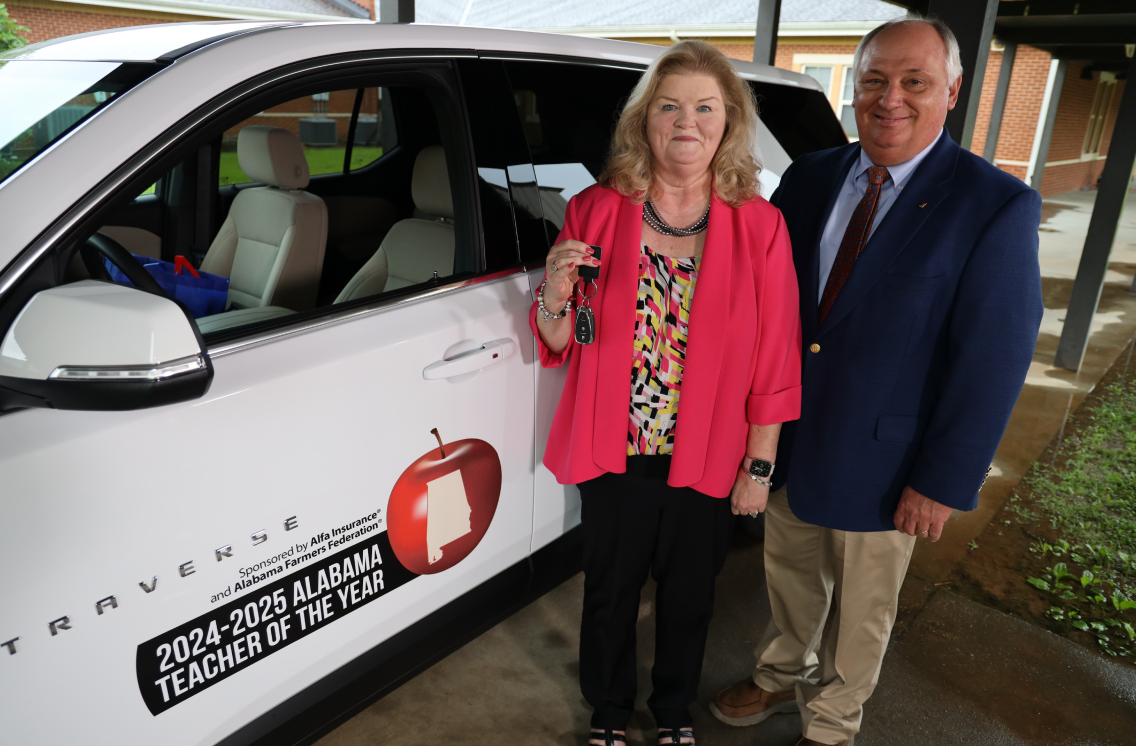 2024-2025 Teacher of the Year Deborah Stringfellow pictured with Alfa Insurance President, Jimmy Parnell.