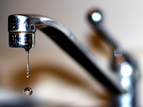 Water faucet dripping water